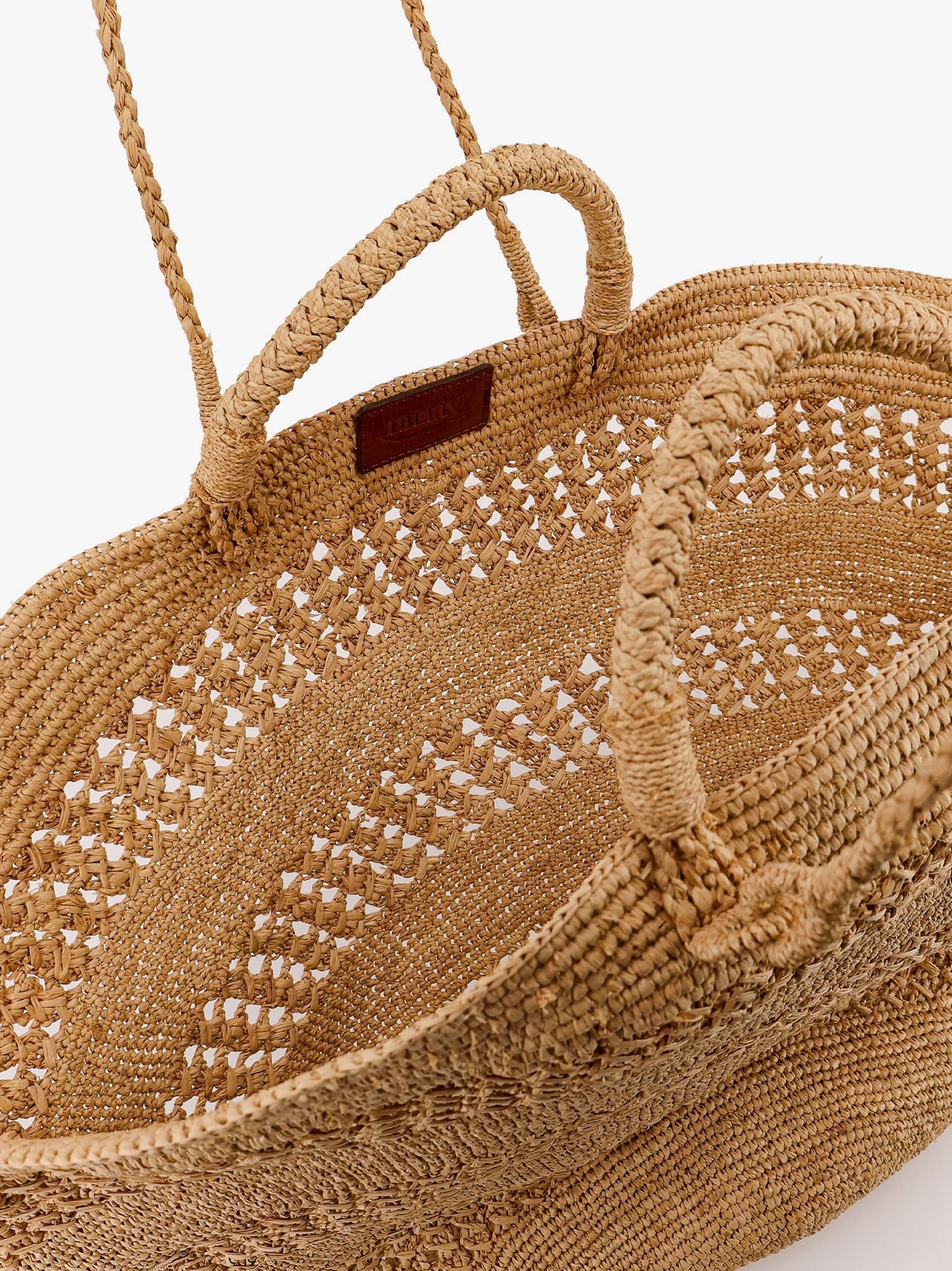ibeliv-sol-perforated-rafia-handbag