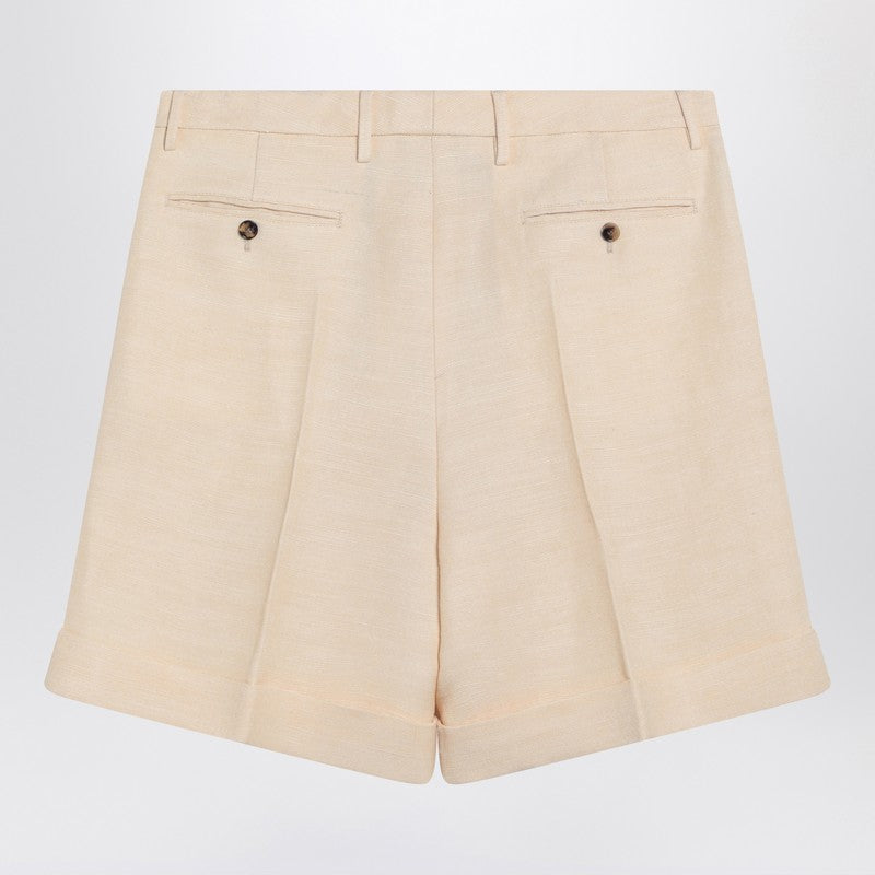 Butter-coloured Bermuda shorts with turn-ups