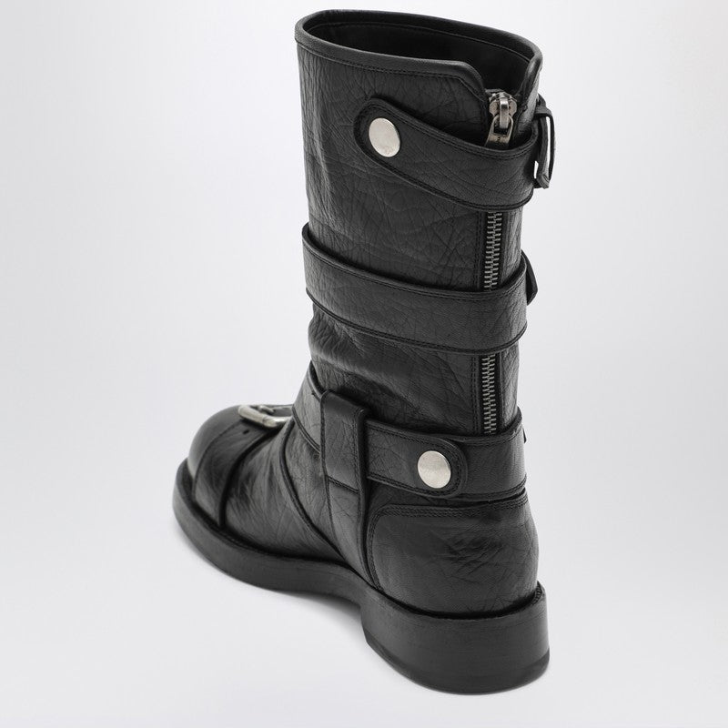 Black leather boots with straps