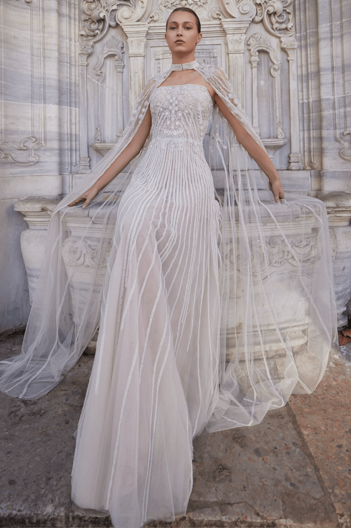 FULLY EMBROIDERED STRAPLESS TULLE DRESS WITH EMBROIDERED CAPE