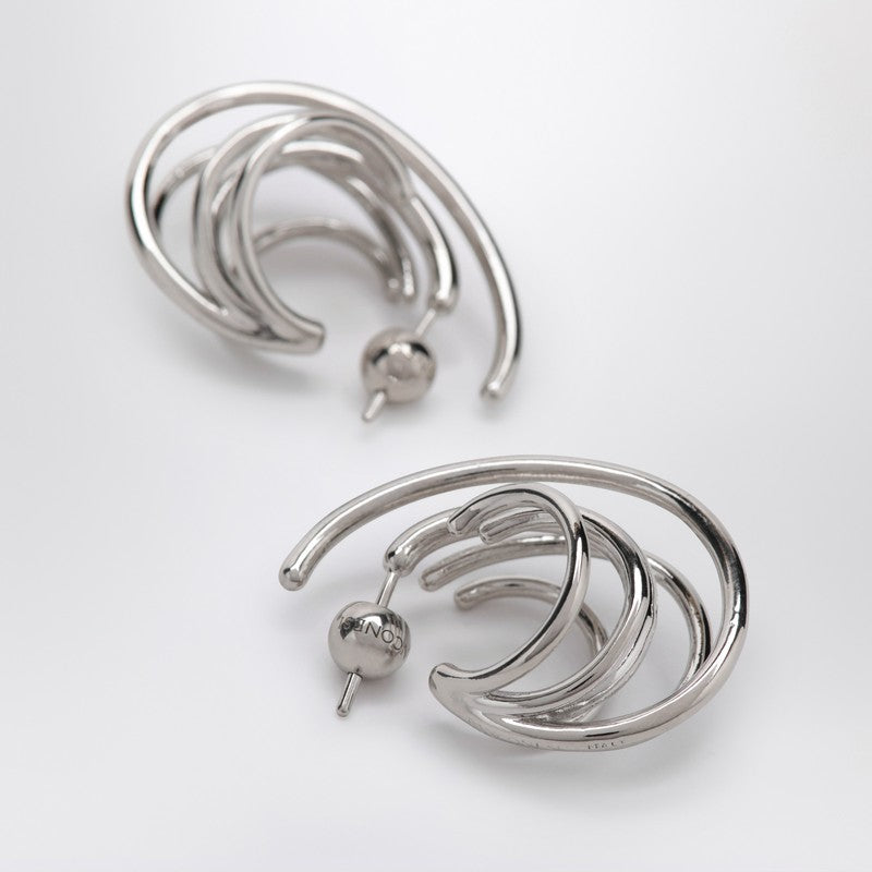 Circular earrings in silver tone