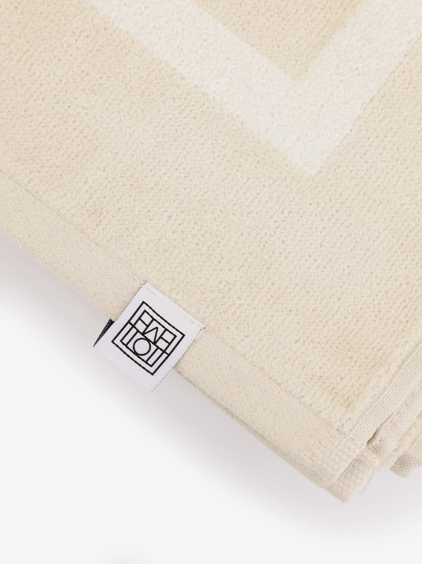 toteme-monogram-organic-cotton-beach-towel