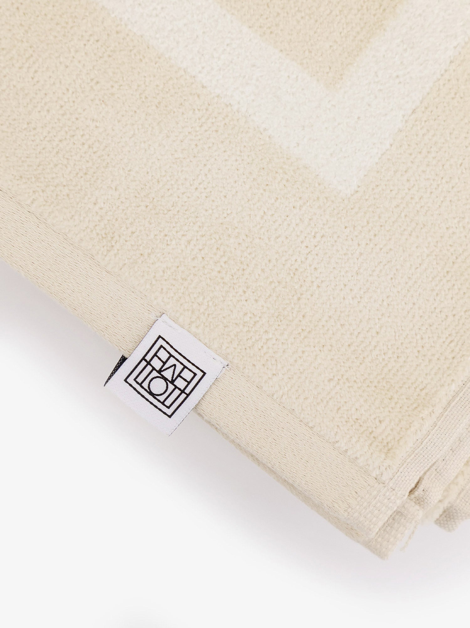 toteme-monogram-organic-cotton-beach-towel