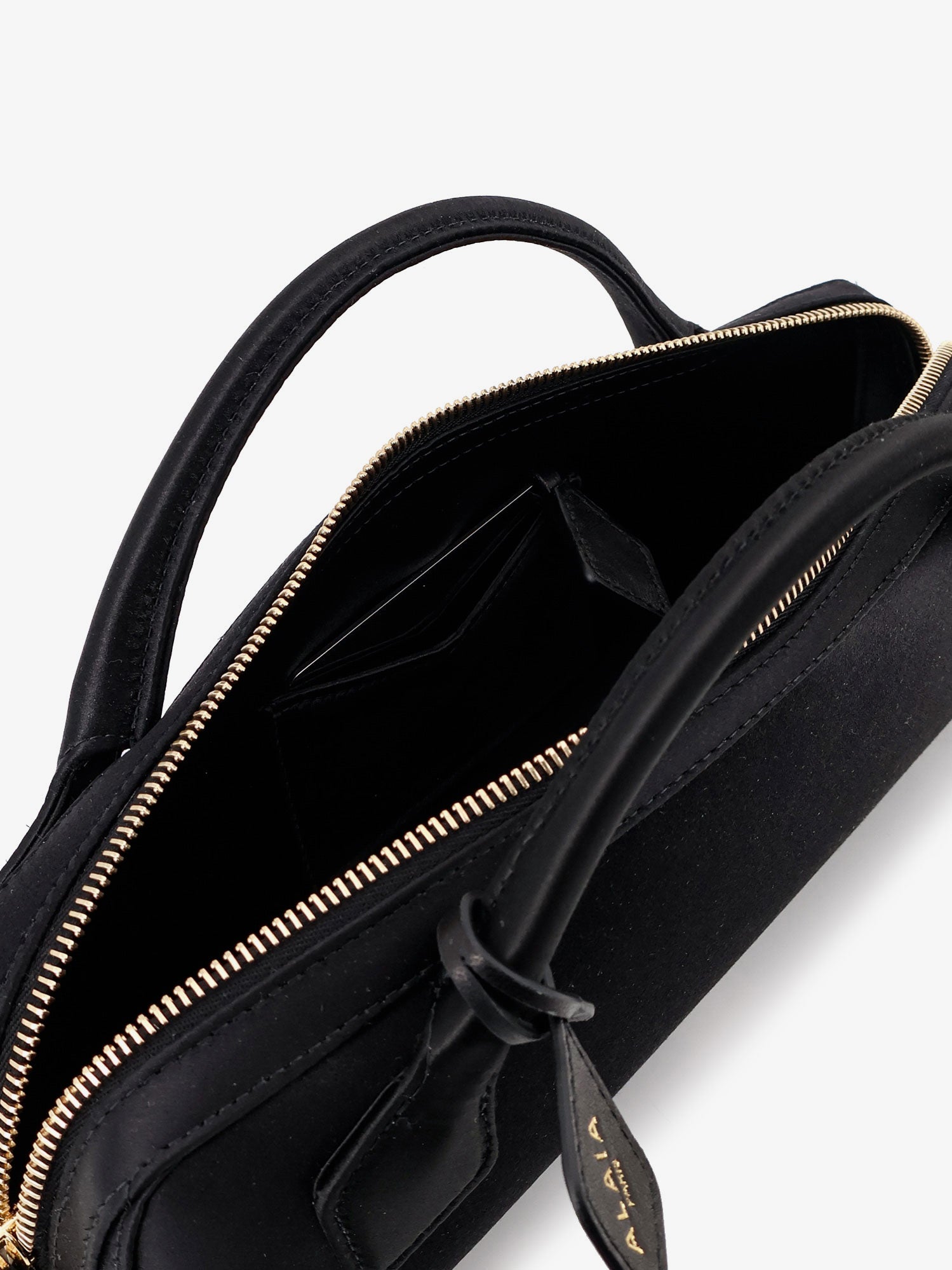 Le Teckel satin handbag with logo on the front