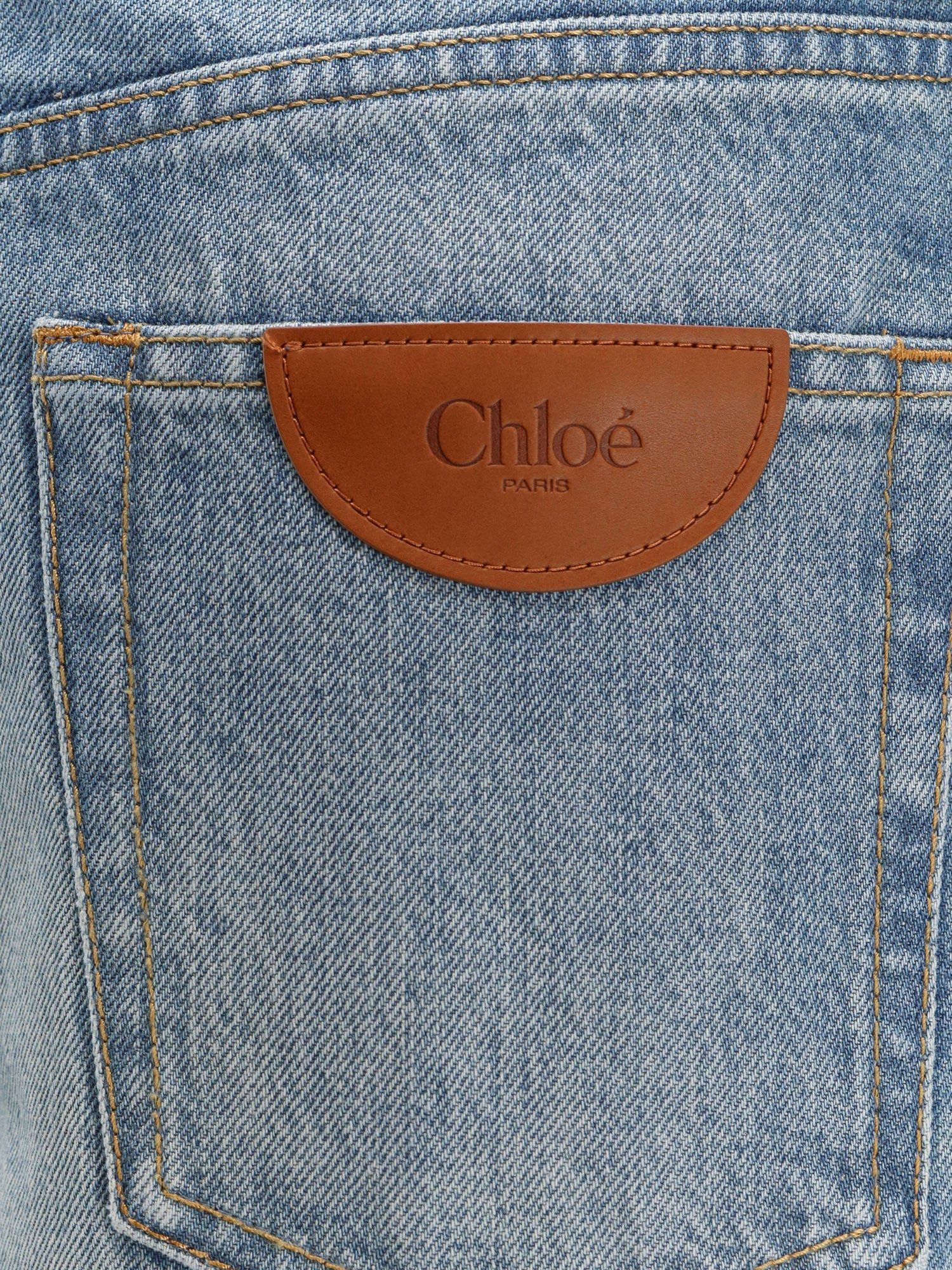 Blue denim jeans with logo label on the back
