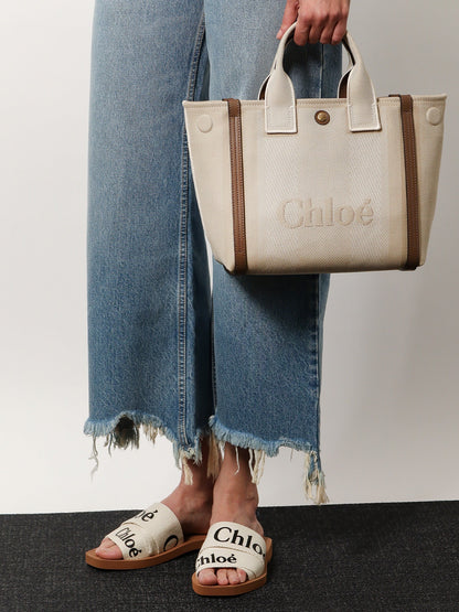 Chloé Carry canvas crossbody bag with oversized logo on the front