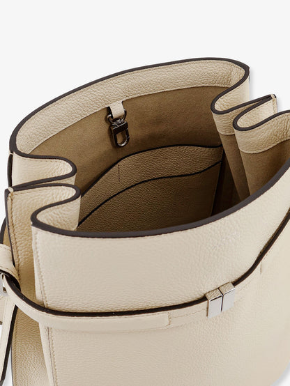 Hammered leather bucket bag with strap on the front