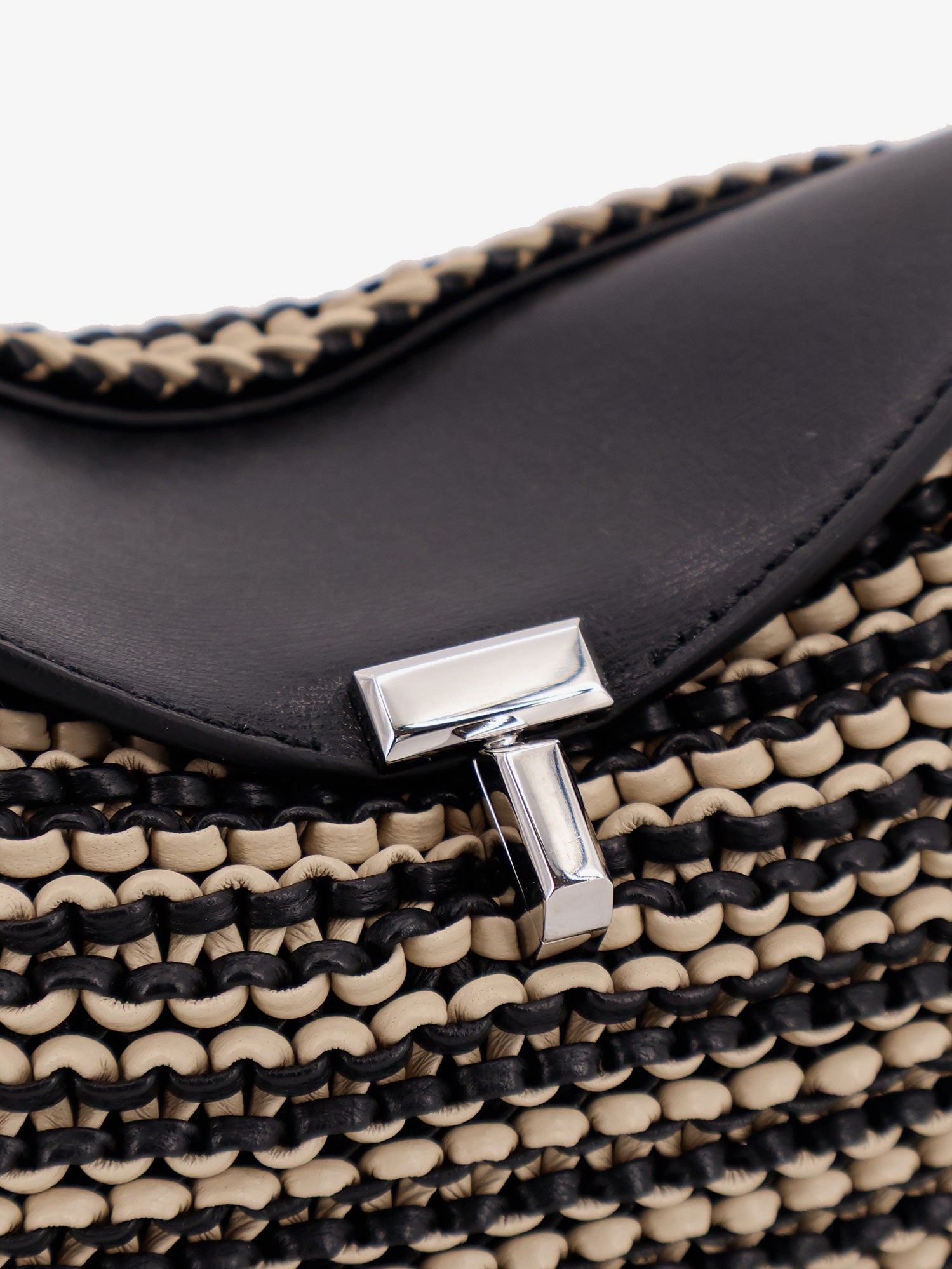 Mini T-lock clutch in leather with woven pattern