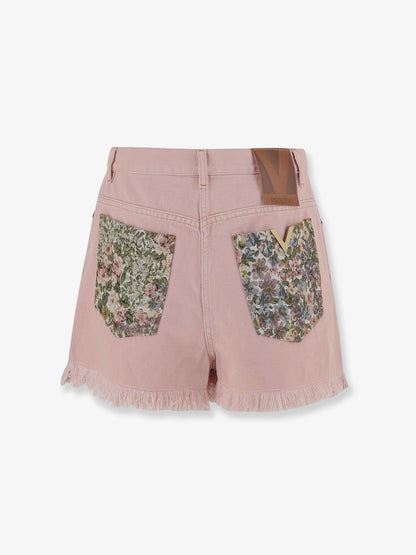 Denim shorts with frayed edges