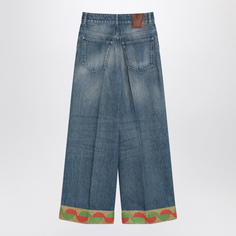Blue washed jeans with jacquard bottoms