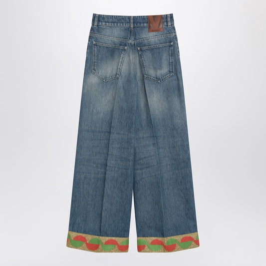 Blue washed jeans with jacquard bottoms