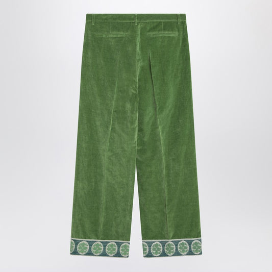 Green velvet trousers with jacquard hem