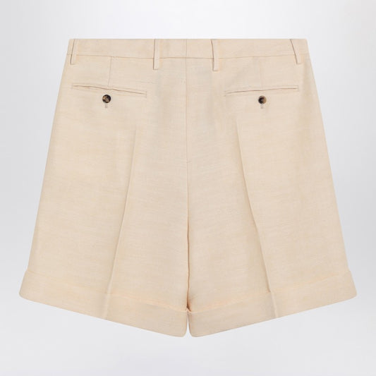 Butter-coloured Bermuda shorts with turn-ups