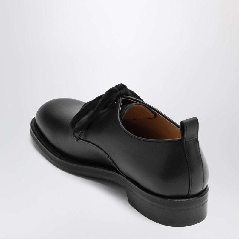 Black leather strap with Vlogo plaque