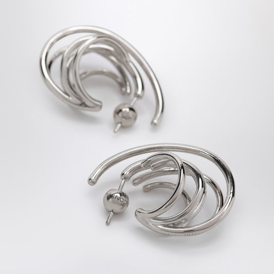 Circular earrings in silver tone